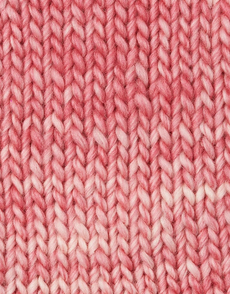 A close-up of a knitted fabric texture in a coral pink