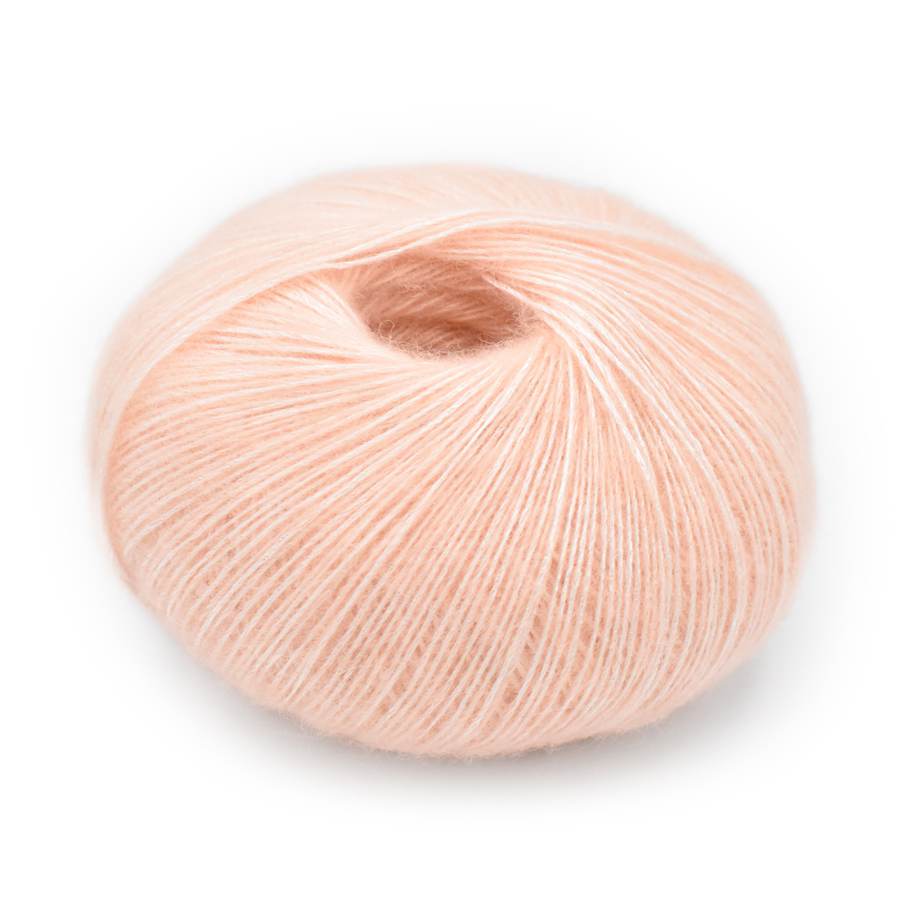 A single ball of peach yarn with subtle silver sheen, photographed on a clean white background.