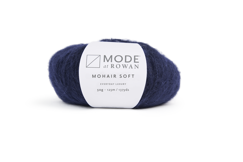 Navy skein of yarn with a Mode de Rowan label on a white background