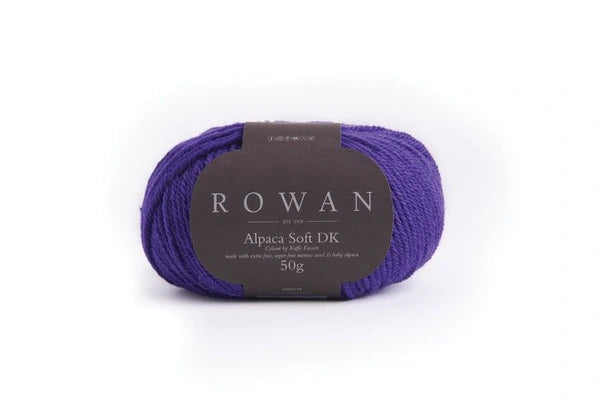 Purple skein of yarn with a Rowan label on a white background