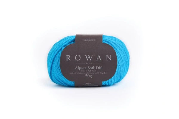 Bright blue skein of yarn with a Rowan label on a white background