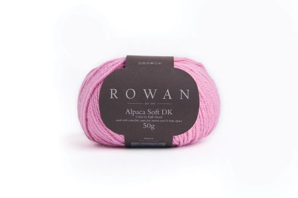 Pink skein of yarn with a Rowan label on a white background