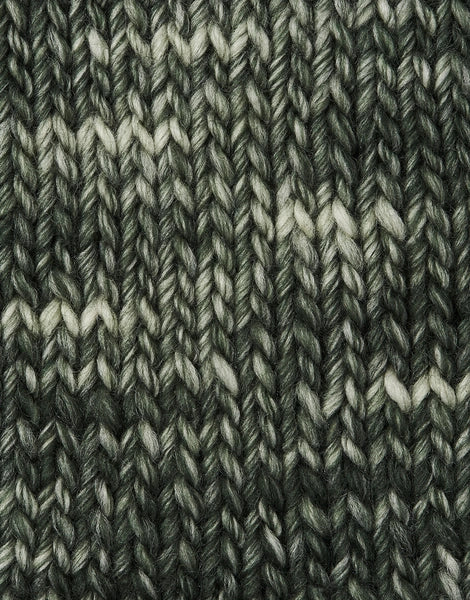 A close-up of a knitted fabric texture in a forest green