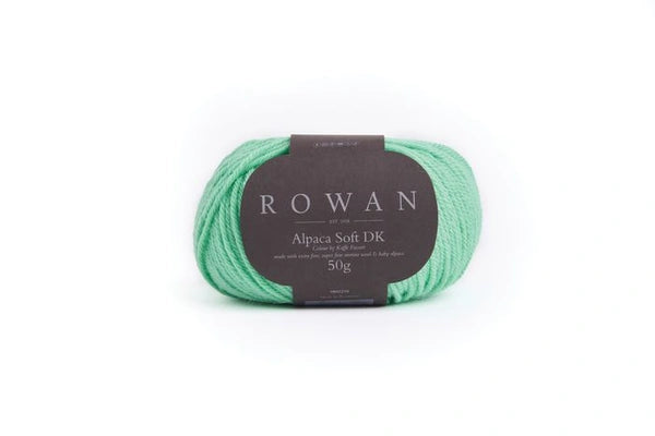 Mint green skein of yarn with a Rowan label on a white background