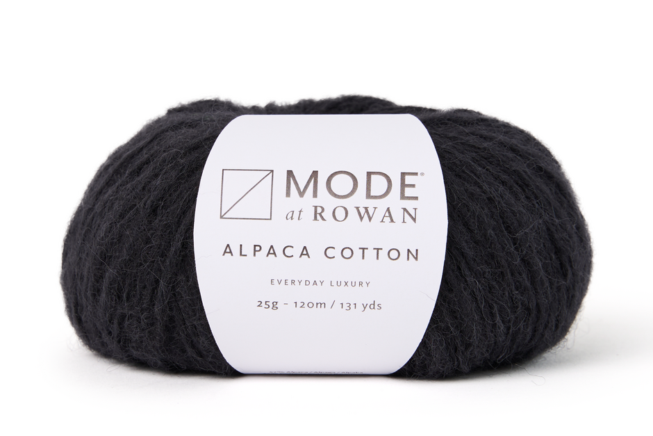 Black yarn skein with a Mode at Rowan label on a white background