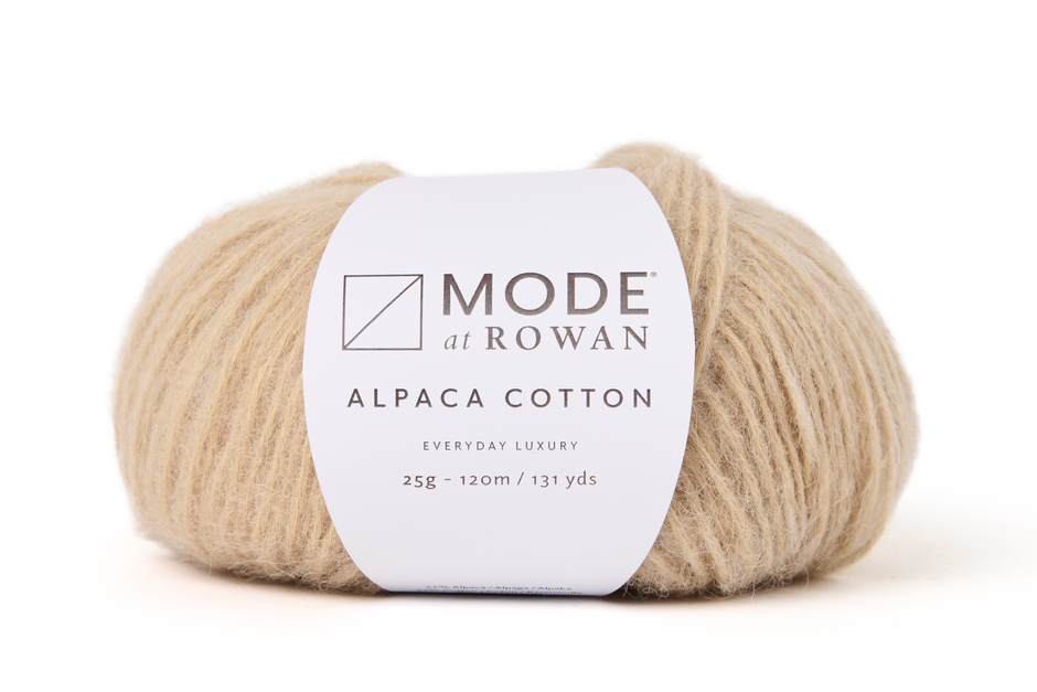 Beige skein of yarn with a 'Mode at Rowan' label on a white background