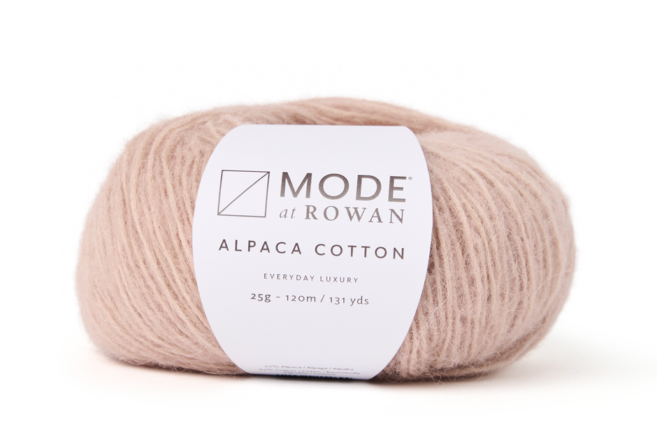 Ball of pink yarn with a Rowan label on a white background