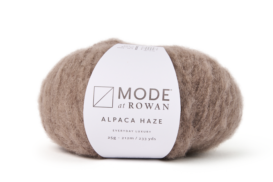 Light brown Ball of Mode at Rowan Alpaca Haze yarn on a white background