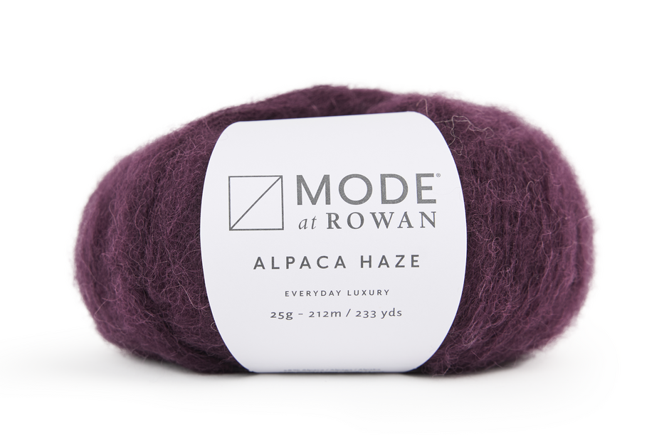 plum yarn skein with Rowan label on a white background