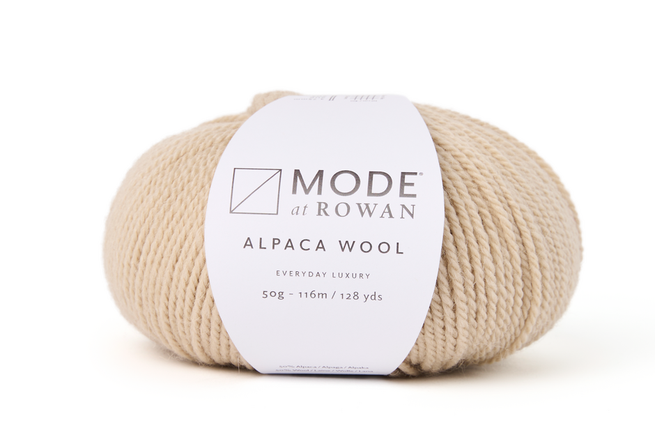 a beige Ball of Mode at Rowan alpaca wool yarn on a white background