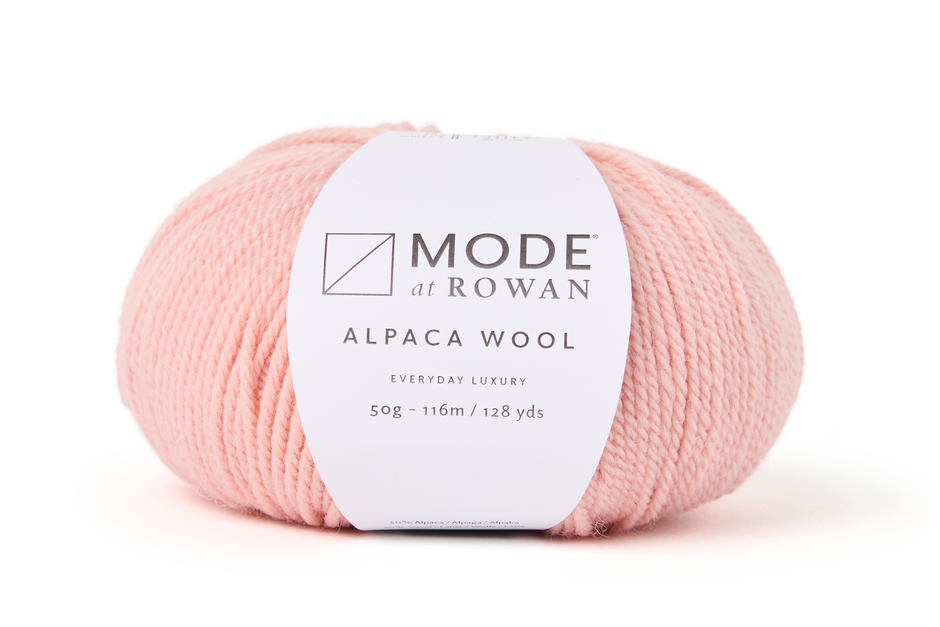 Ball of pink yarn with a Rowan label on a white background