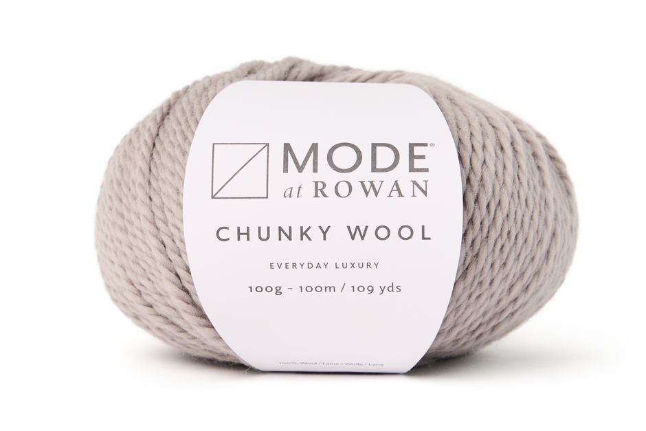 Ball of Mode at Rowan Chunky Wool beige yarn on a white background