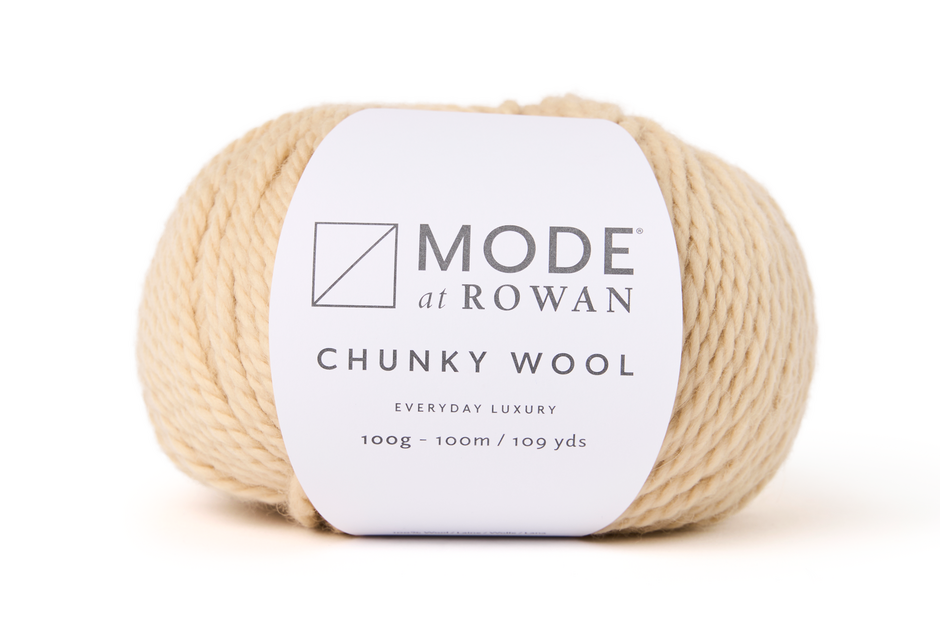 light tan color Ball of Mode at Rowan Chunky Wool yarn on a white background
