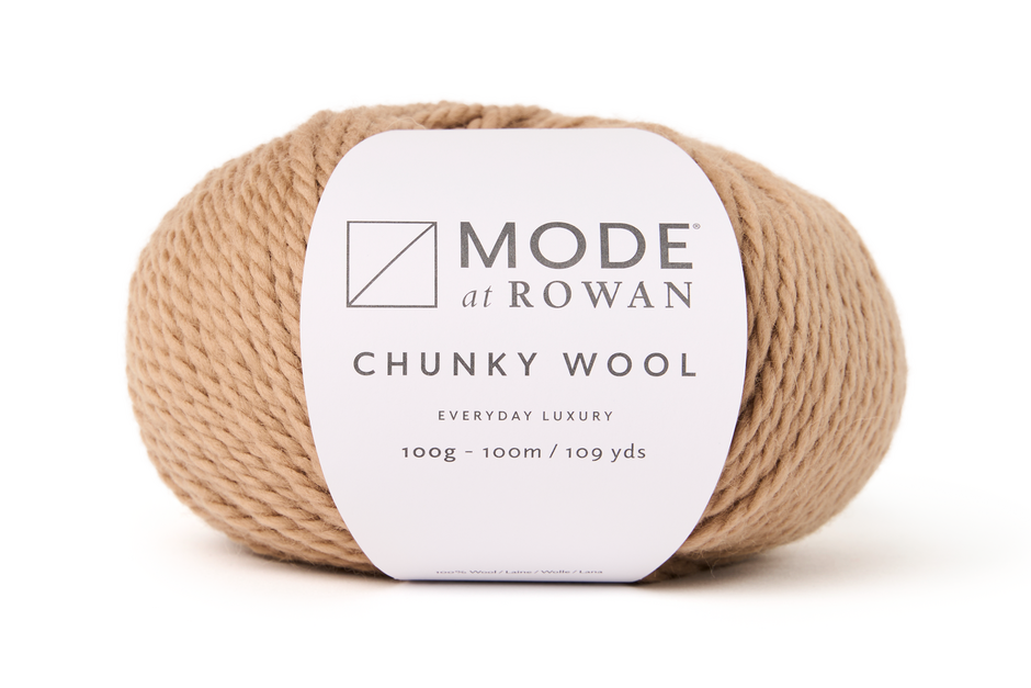 light brown color Ball of Mode at Rowan Chunky Wool yarn on a white background
