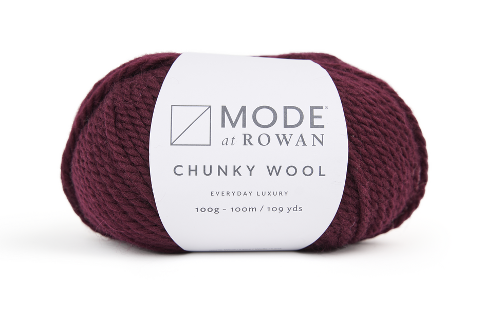 Burgundy skein of Mode at Rowan Chunky Wool yarn on a white background