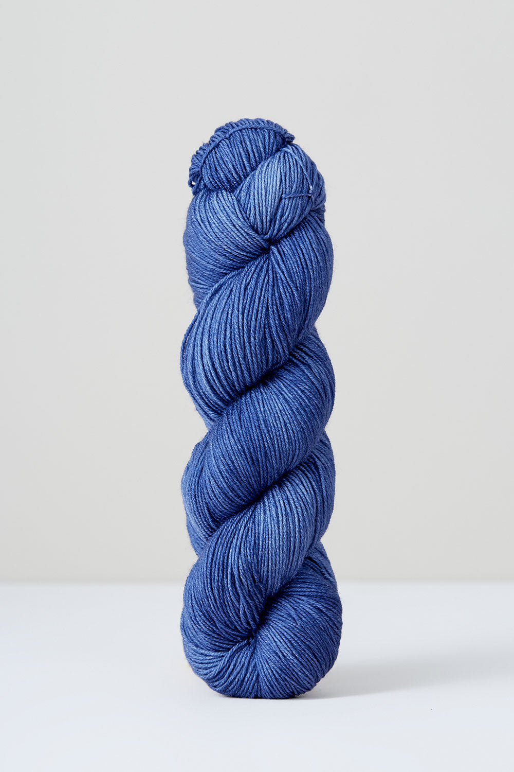 Light blue skein of yarn on a white background