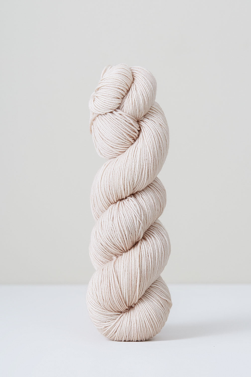 White skein of yarn on a white background