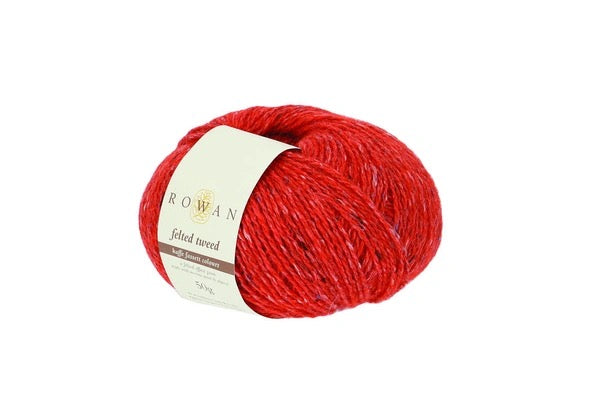 A skein of Rowan Felted Tweed yarn in a vibrant red color, wrapped with a cream-colored paper label, set against a plain white background.