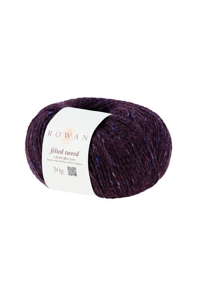 Ball of purple yarn with tweed bits with a Rowan label on a white background
