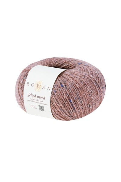 warm pink Ball of yarn with tweed bits with a Rowan label on a white background