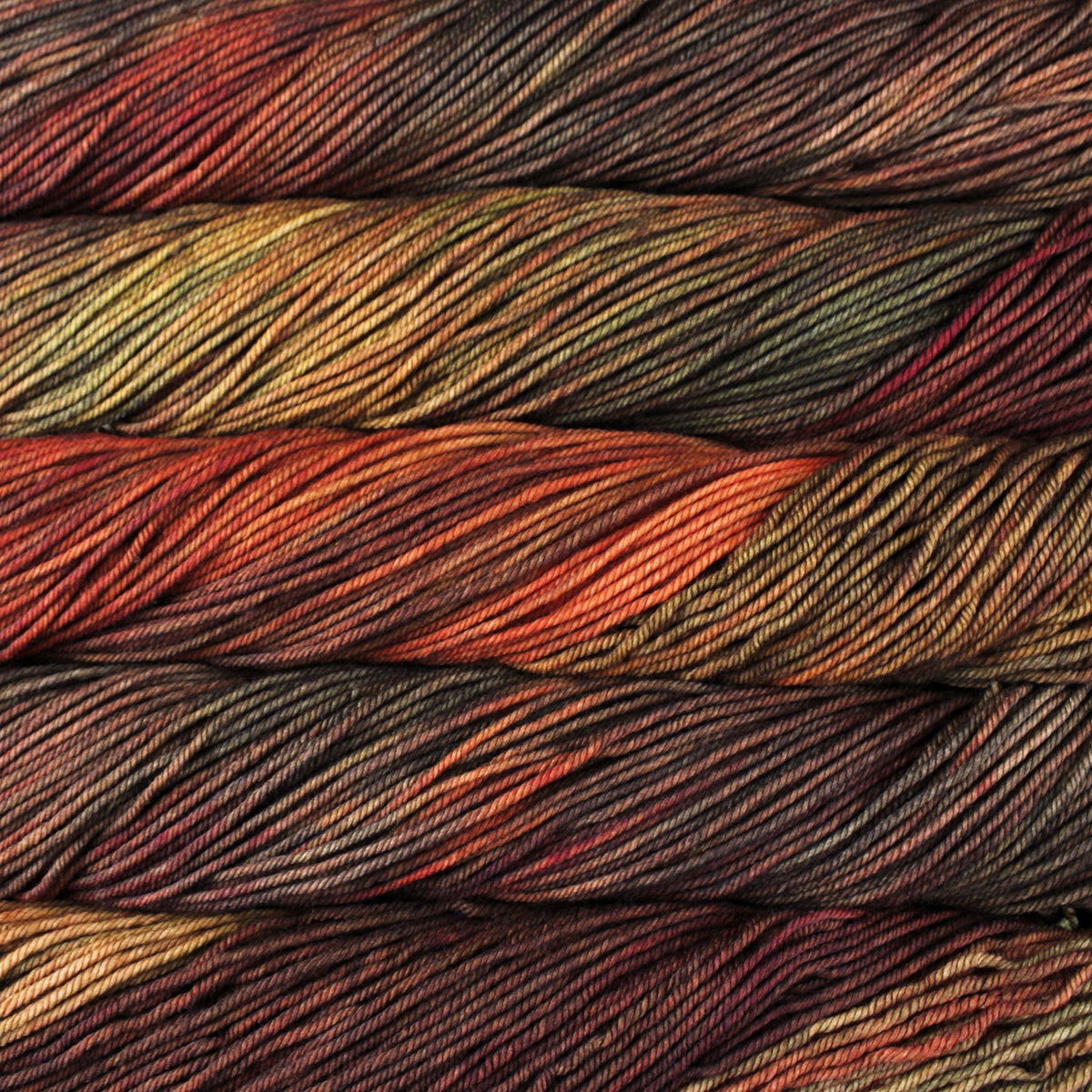 Close-up of multicolored yarn with shades of red, green, and brown.