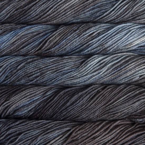 Close-up of multicolored yarn with shades of blue and grey.