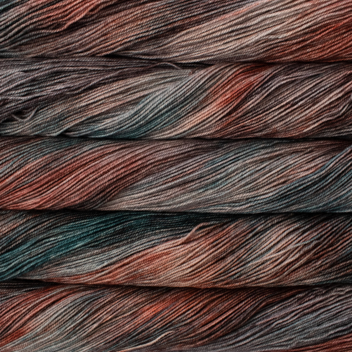 Close-up of multicolored yarn with shades of blue, red, and brown.