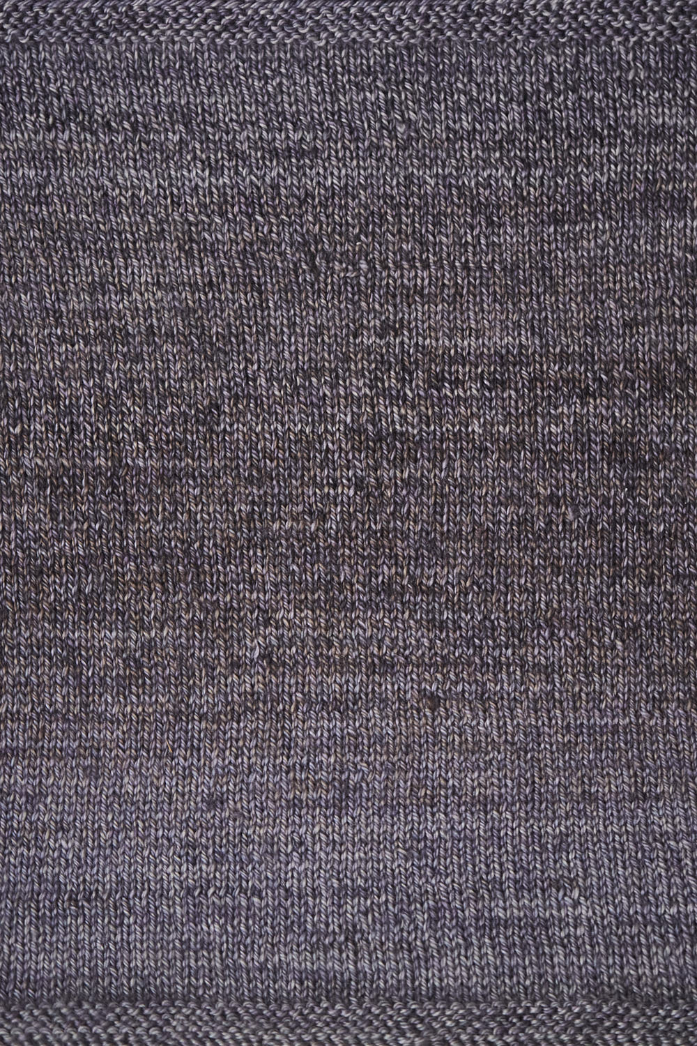 Close up of a swatch showing the purple and grey gradient.