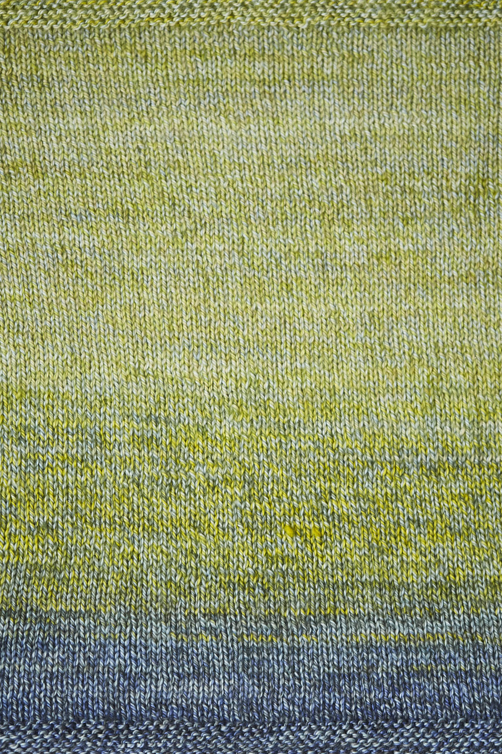 Close up of a swatch showing the green and blue gradient.