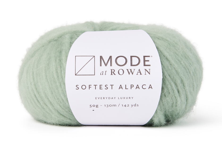 Ball of pale green yarn with a 'Mode at Rowan' label on a white background