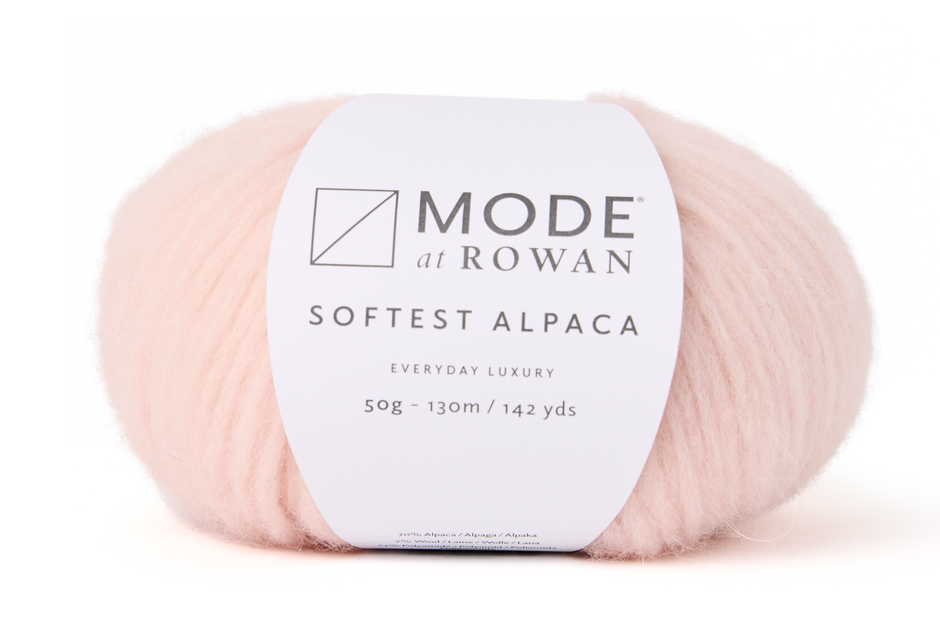 Ball of pale pink yarn with a 'Mode at Rowan' label on a white background