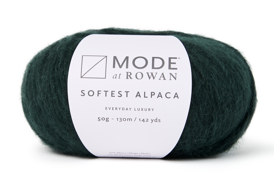 Dark green skein of yarn with a Rowan label on a white background