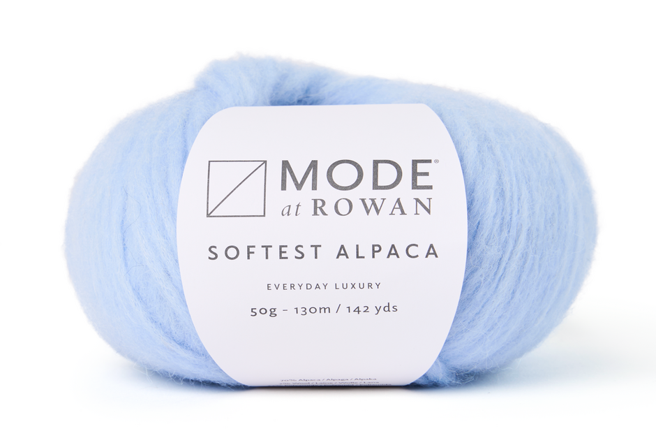 Ball of light blue yarn with a Mode at Rowan label on a white background