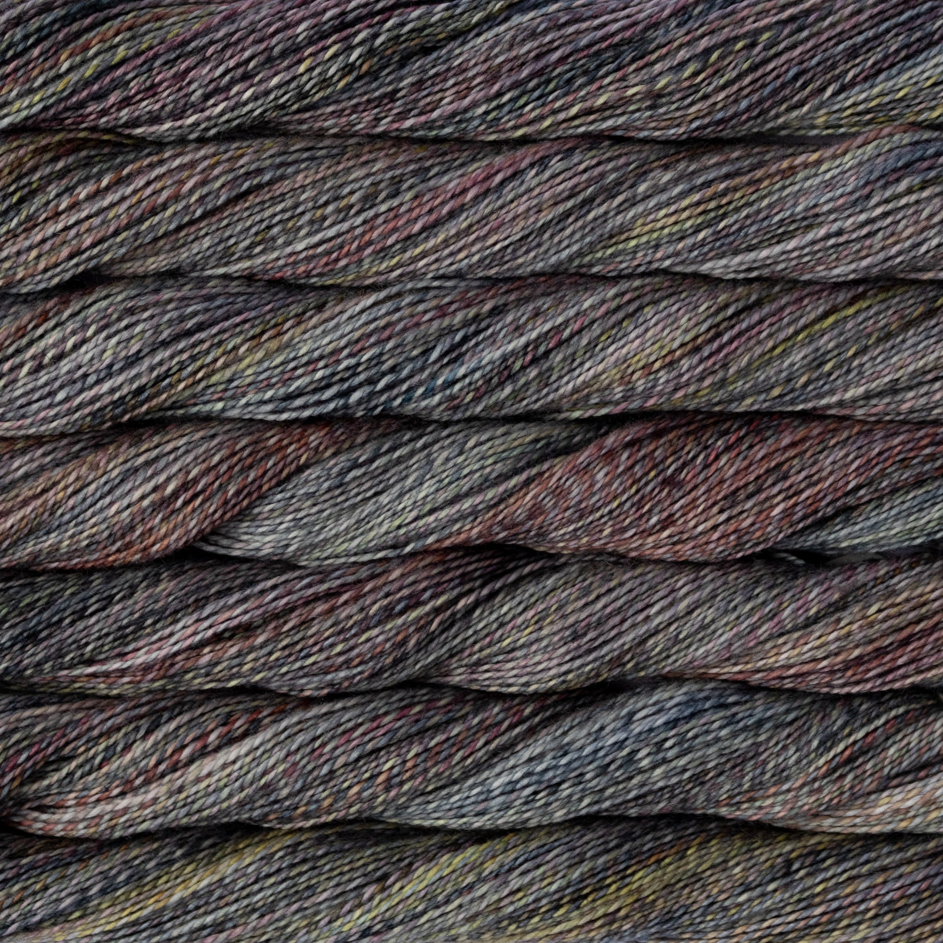 Close-up of multicolored yarn with shades of brown, gray, and black.