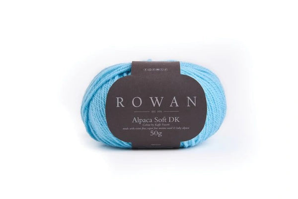 Blue skein of yarn with a Rowan label on a white background
