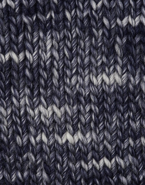 A close-up of a knitted fabric texture in a navy blue