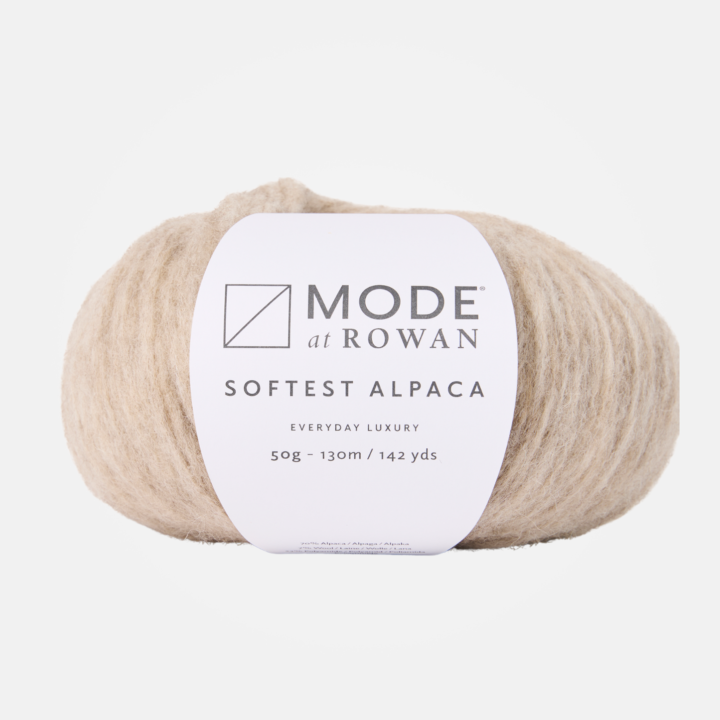 A beige ball of Mode at Rowan Softest Alpaca yarn in a light beige color, featuring a white paper label with black text, set against a clean light gray background.