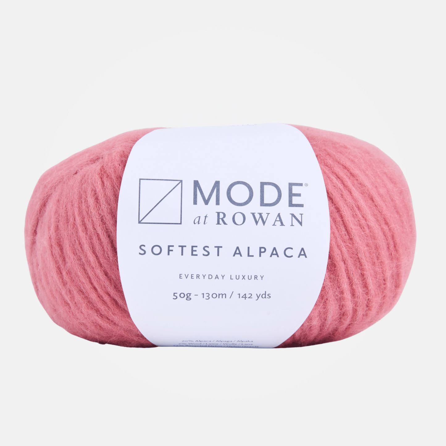A ball of pink MODE at ROWAN Softest Alpaca yarn with a white paper label, shown against a light gray background.