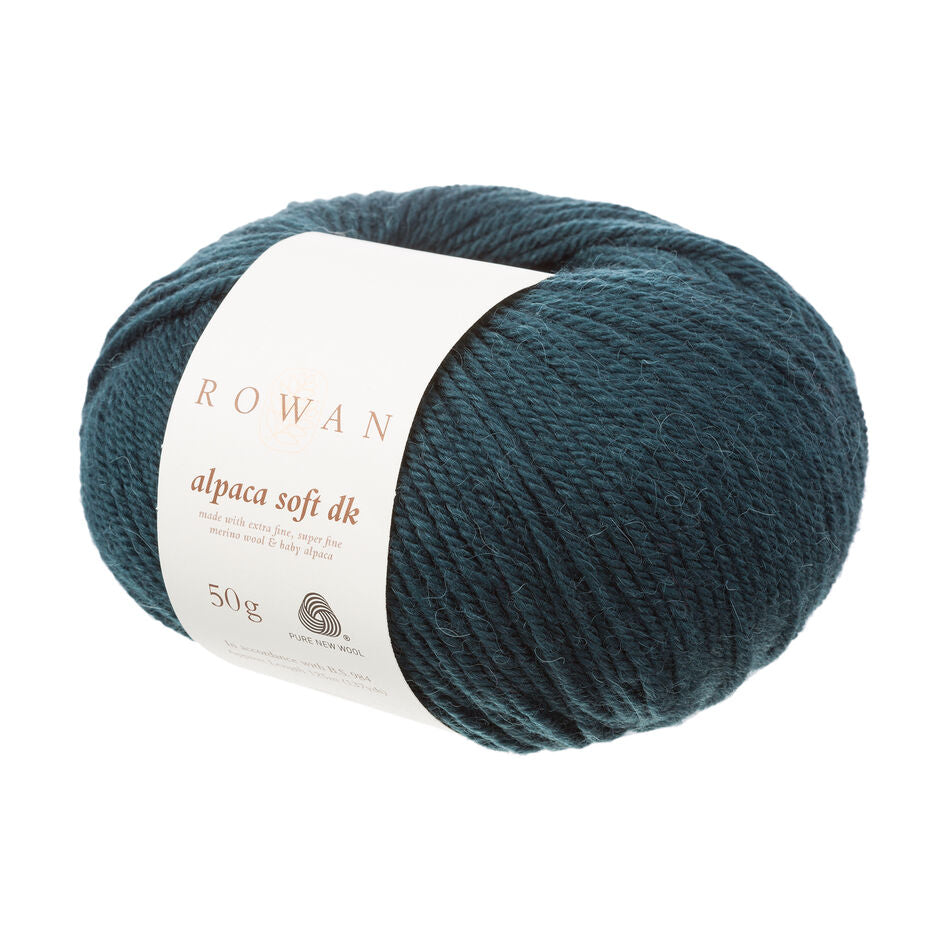 Teal skein of yarn with a Rowan label on a white background