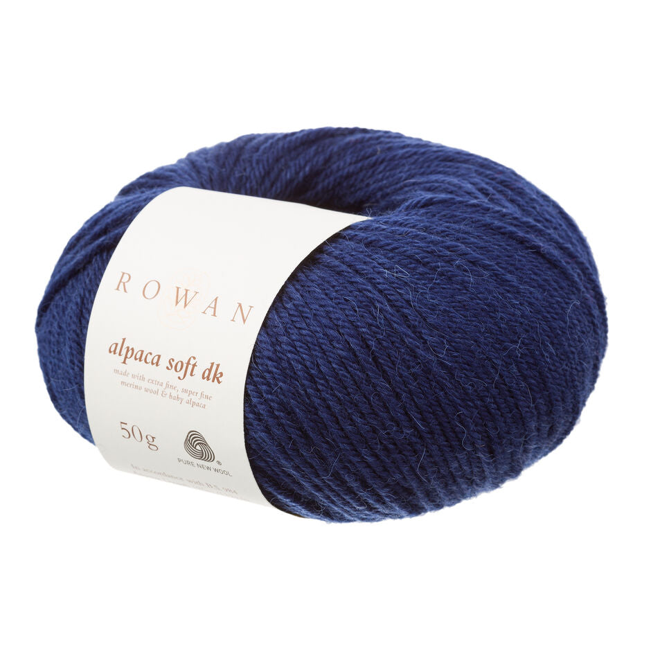 Dark blue skein of yarn with a Rowan label on a white background