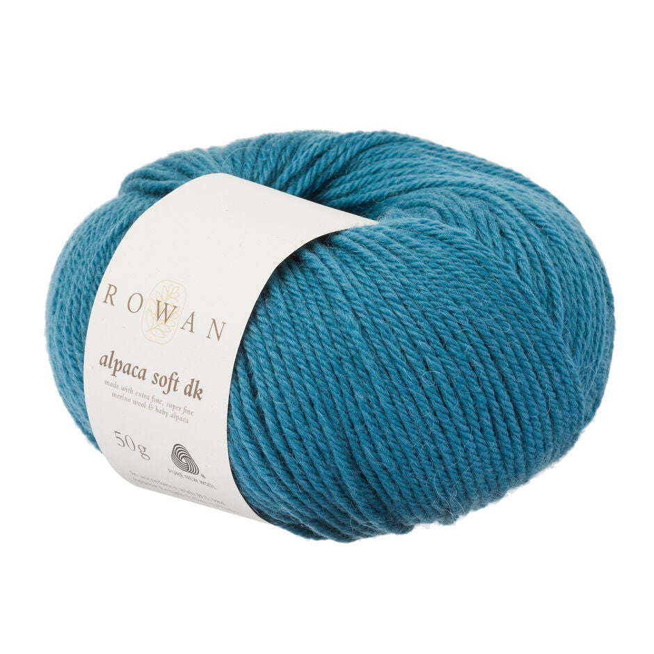 Blue skein of Rowan alpaca soft DK yarn on a white background