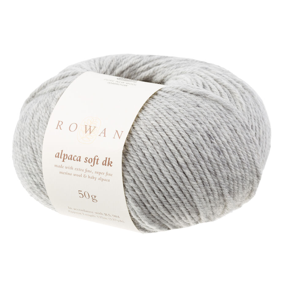 Gray skein of yarn with a Rowan label on a white background