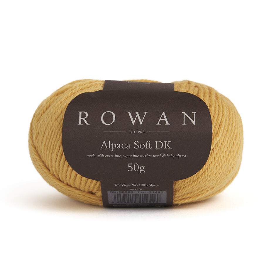 Yellow skein of yarn with a Rowan label on a white background